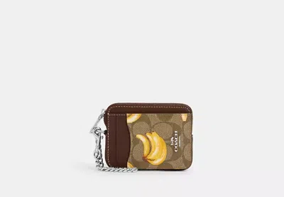 Coach Outlet Zip Card Case In Signature Canvas With Banana Print In Brown