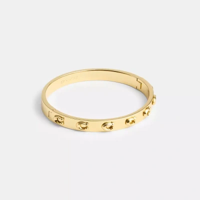 Coach Pegged Signature Hinged Bangle In Gold