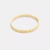 Coach Repeated C Hinged Bangle In Gold
