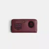 Coach Restored Accordion Zip Wallet With Varsity Patches In Purple