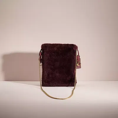 Coach Restored Drawstring Pouch In Shearling In Brass/sangria