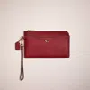 Coach Restored L Zip Wristlet In Brass/cherry