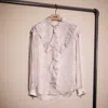 COACH RESTORED PRINTED LONG SLEEVE BLOUSE WITH RUFFLES