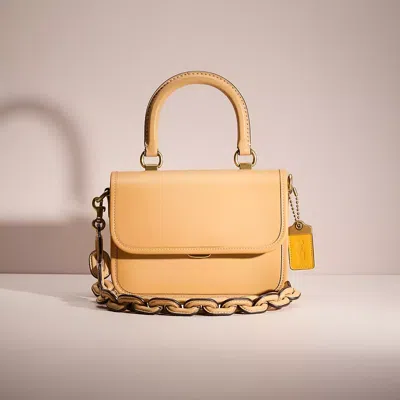 Coach Restored Rogue Top Handle Bag In Brass/tan