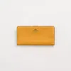 Coach Restored Skinny Wallet In Brass/buttercup
