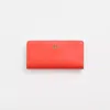Coach Restored Skinny Wallet In Brass/red Orange