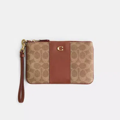 Coach Restored Small Wristlet In Signature Canvas In Gold