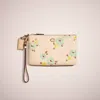 Coach Restored Small Wristlet With Floral Print In Brass/ivory Multi