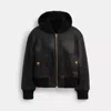Coach Reversible Shearling Hoodie In Black