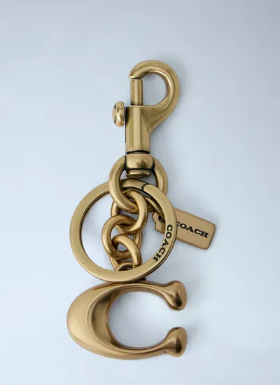 Coach Signature C Bag Charm In Gold