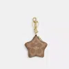Coach Star Bag Charm In Signature Canvas In Brown