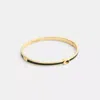 Coach Thin Enamel Signature Hinged Bangle In Black