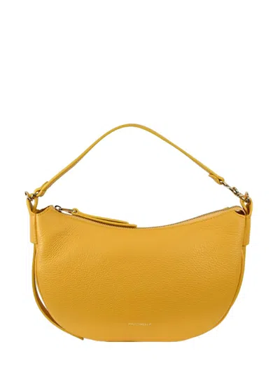 Coccinelle Bags.. In Yellow