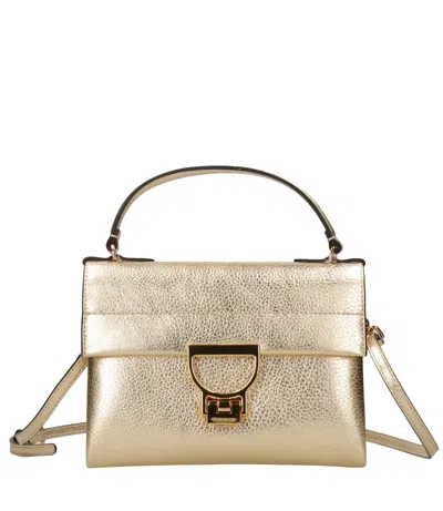 Coccinelle Bags.. Golden