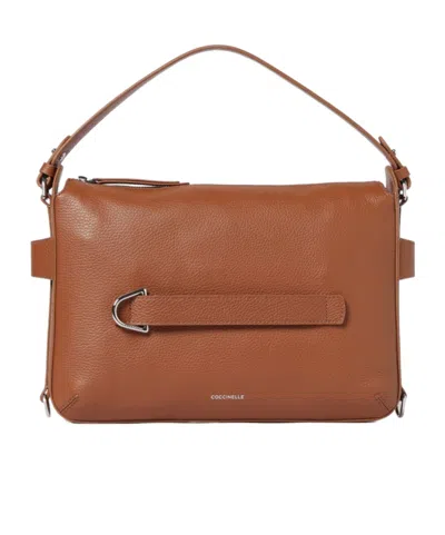 Coccinelle Buckle Strap Shoulder Bag In Brown