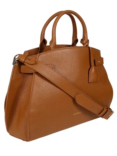 Coccinelle Klichè Medium Top Handle Bag In Brown