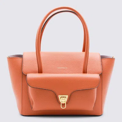 Coccinelle Medium Double Beat Leather Shoulder Bag In Orange