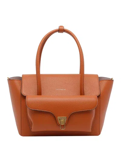 Coccinelle Double Beat Shoulder Bag In Orange