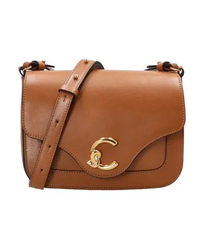 Coccinelle Flip Shoulder Bag In Brown