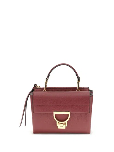 Coccinelle Handbags In Brown