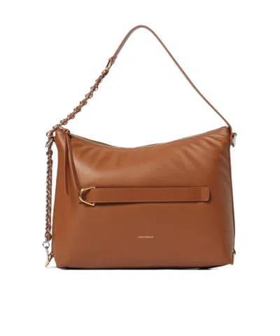 Coccinelle Logo Printed Zipped Shoulder Bag In Brown