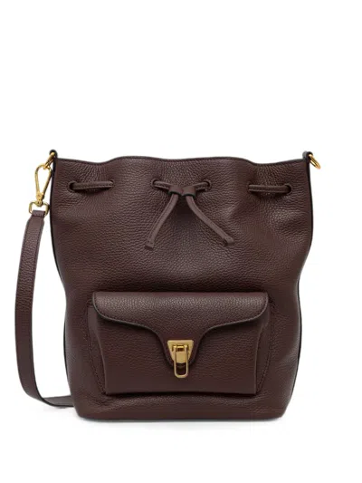 Coccinelle Medium Beat Generation Pebbled-leather Drawstring Bucket Bag In Brown