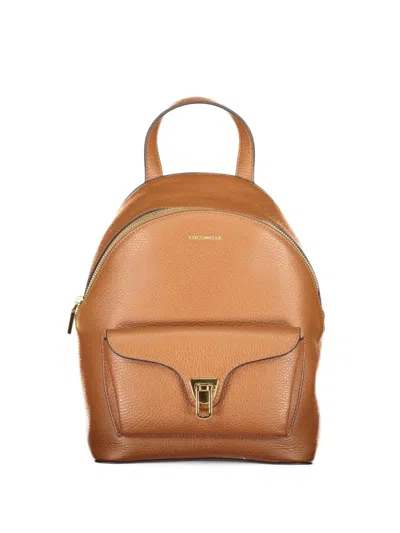 Coccinelle Small Beat Grained Leather Backpack In Brown