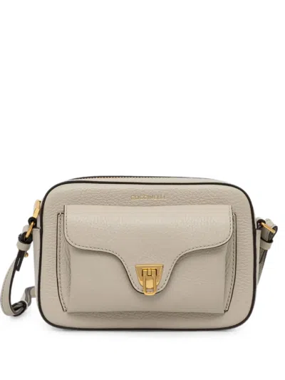 Coccinelle Small Beat Grained Leather Shoulder Bag In Neutral