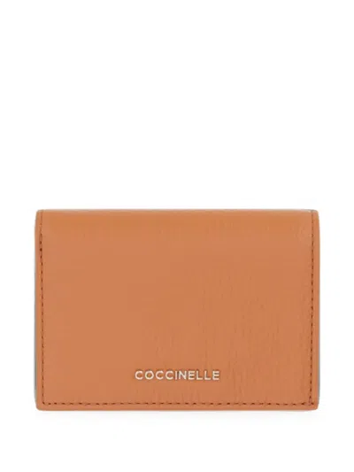 Coccinelle Small Metallic Logo-plaque Wallet In Orange