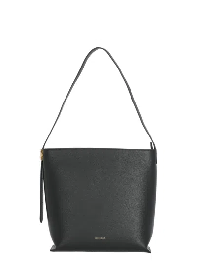 Coccinelle Structured Pebbled Leather Shoulder Bag With Lock Detail In Black