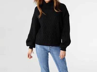 Coco + Carmen Maren Cable Knit Turtleneck Sweater In Black