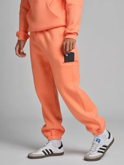 Comfrt Airplane Mode Travel Sweatpants In Orange