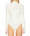 Commando Neoprene Turtleneck Bodysuit With Thumbholes In Ivory In White