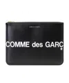 Comme Des Garçons Wallet Logo Printed Zipped Clutch Bag In Black