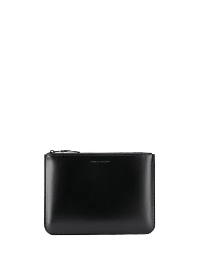 Comme Des Garçons Embossed Logo Wallet In Black