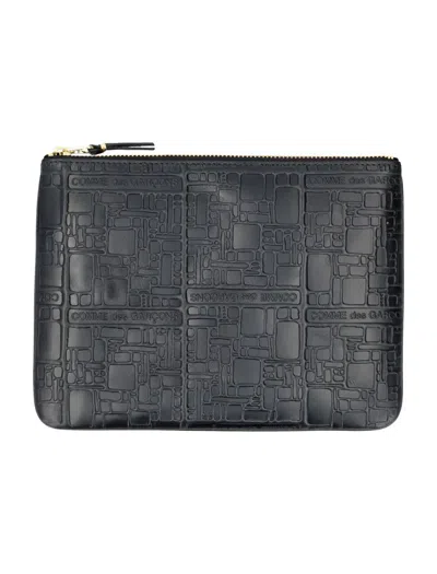 Comme Des Garçons Embossed Logotype Pouch In Black