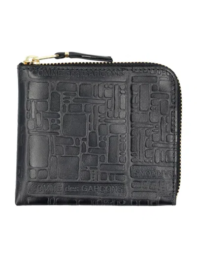 Comme Des Garçons Embossed Logotype Wallet In Black