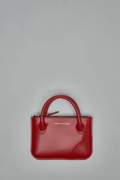 Comme Des Garçons Handles In Red