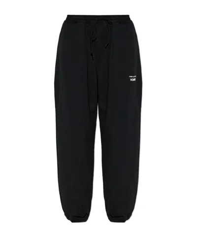 Comme Des Garçons Homme Logo Printed Pants In Black
