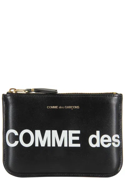 COMME DES GARÇONS HUGE LOGO
