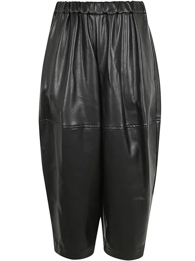 Comme Des Garçons Pleated Tapered Leg Trousers In Black