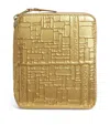 Comme Des Garçons Leather Embossed Logo Zipped Wallet In Gold