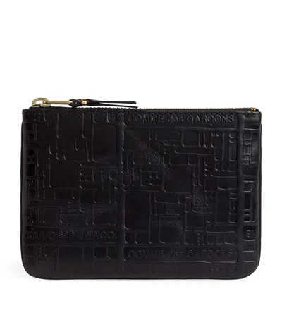 Comme Des Garçons Leather Logo Embossed Zipped Pouch In Black