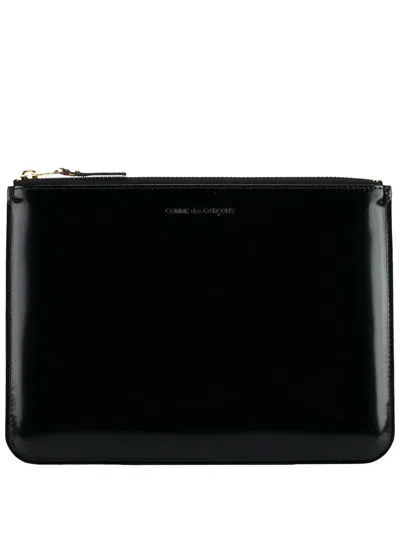 Comme Des Garçons Logo-debossed Leather Clutch Bag In Black
