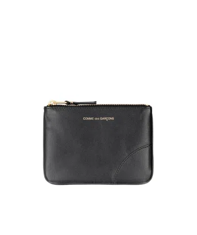 Comme Des Garçons Logo-embossed Leather Pouch In Black