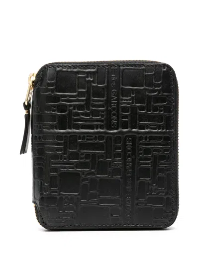 Comme Des Garçons Logo Embossed Wallet In Black