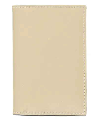 Comme Des Garçons Logo-embossed Leather Wallet In Neutral
