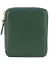 Comme Des Garçons Logo Print Zipped Wallet In Bgrn Bottle Green