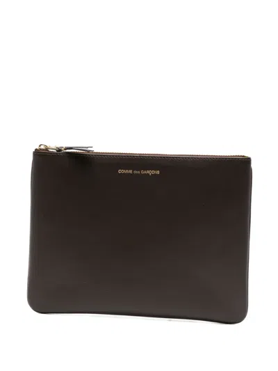 Comme Des Garçons Logo-print Leather Clutch Bag In Brown