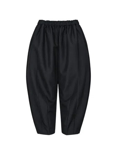 Comme Des Garçons Pleated Tapered Trousers In Black